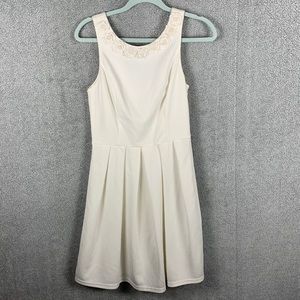 Cream sleeveless dress with bow in the back, size medium from Francesca’s